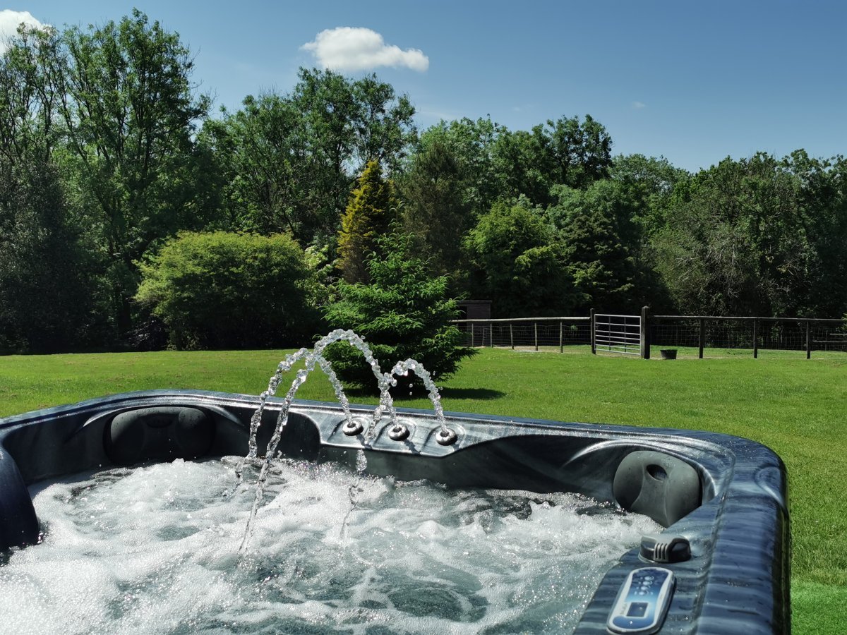 Soak in the hot tub looking West. The sun in your face watching the Alpacas with Red Kites soaring overhead.