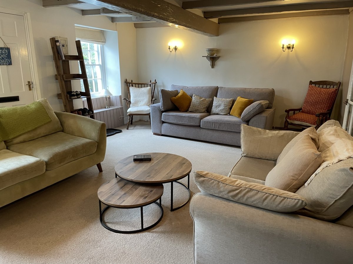 Dolphin House - spacious lounge with comfy sofas