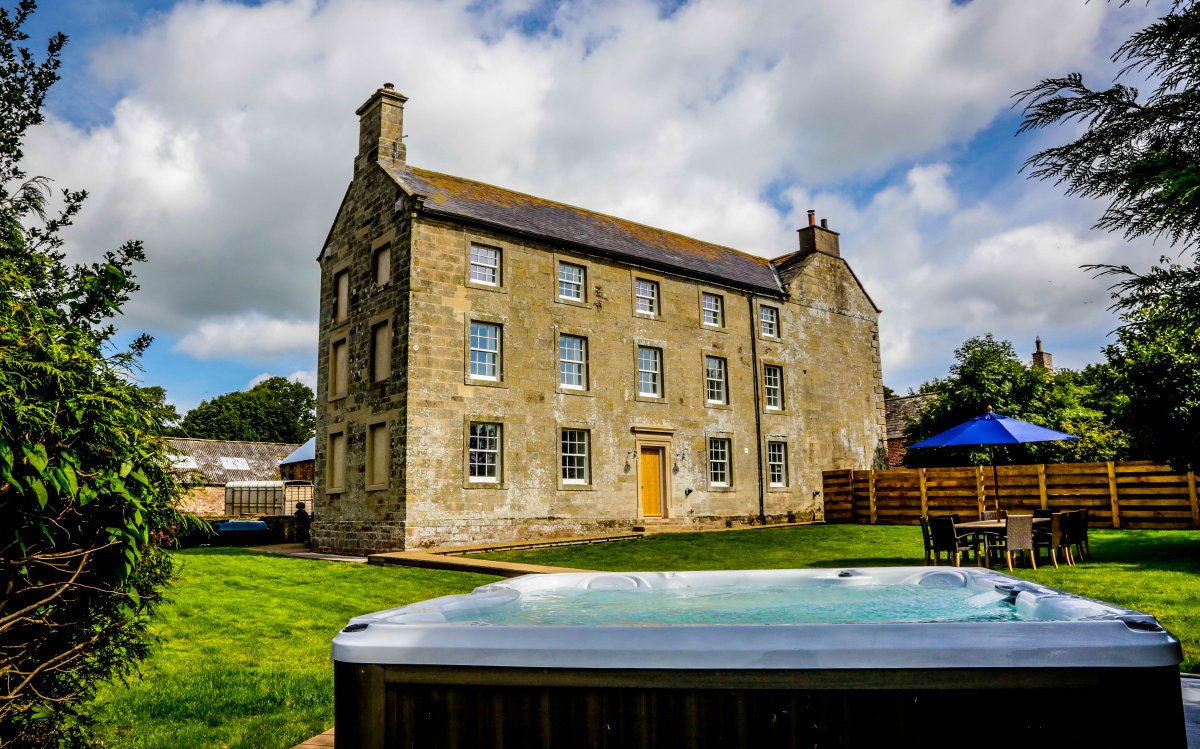 Group accommodation with a hot tub