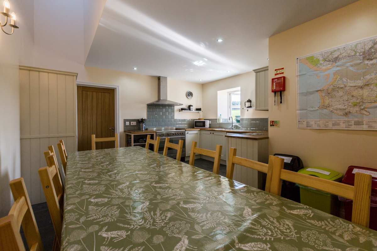 Large table in the kitchen that seats 10 people in The Chaffhouse