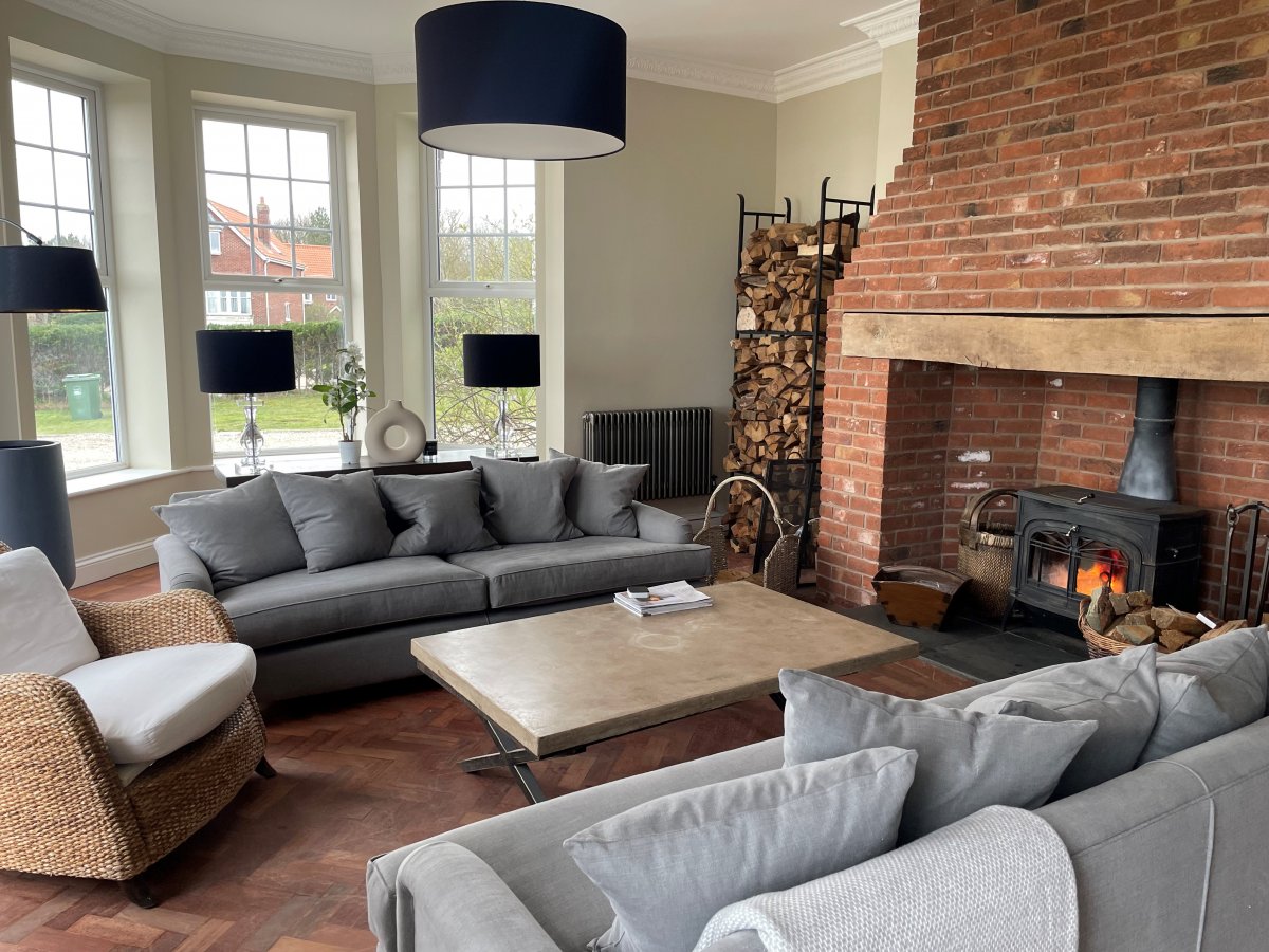 Sea View Manor - drawing room with a cosy wood burner