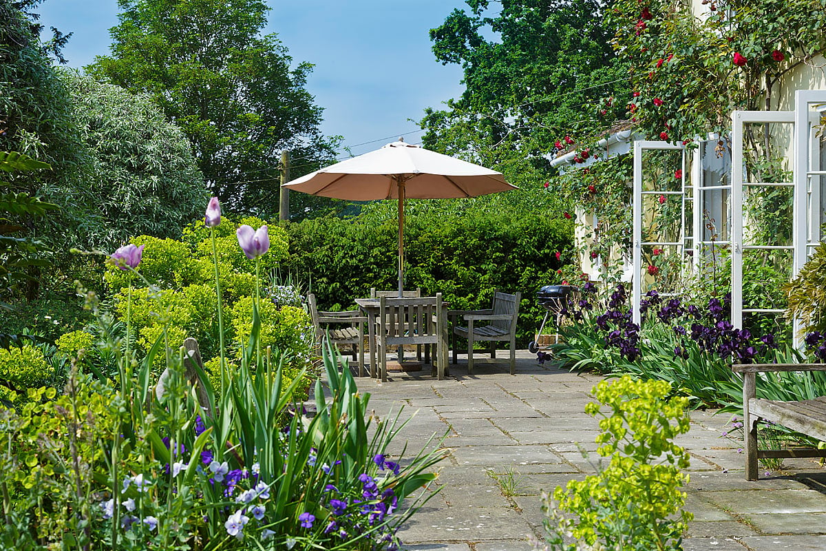 The south-facing terrace with BBQ at The Old Rectory, Kettlebaston