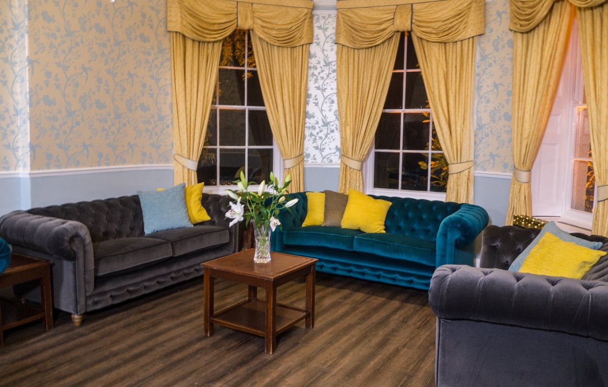 Bindon Country House - spacious and comfy sitting room with a fire