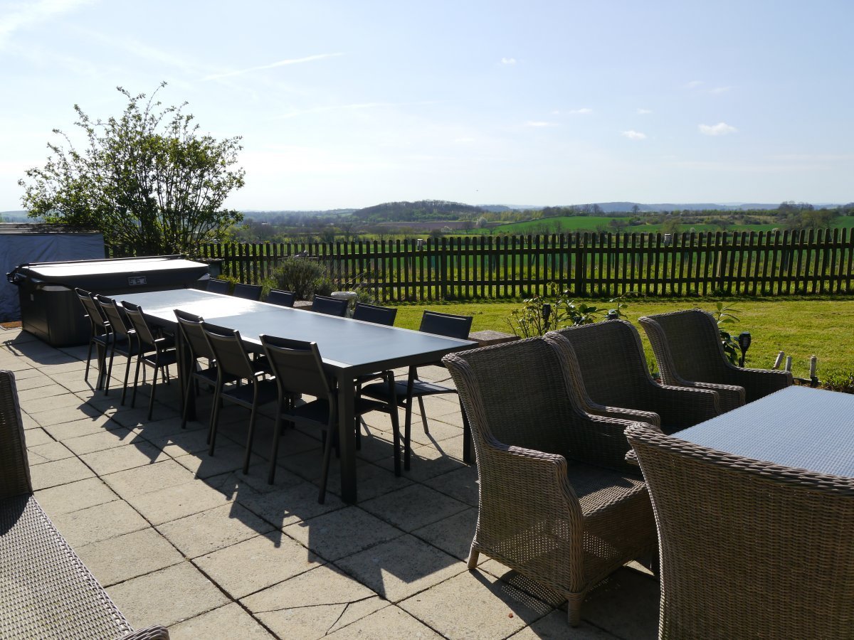 Rear south facing patio with hot tub, garden furniture and views!