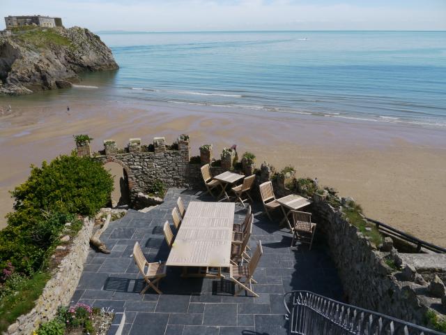 Courtyard with private steps to the beach. Sheltered seating under balcony as well as in courtyard.