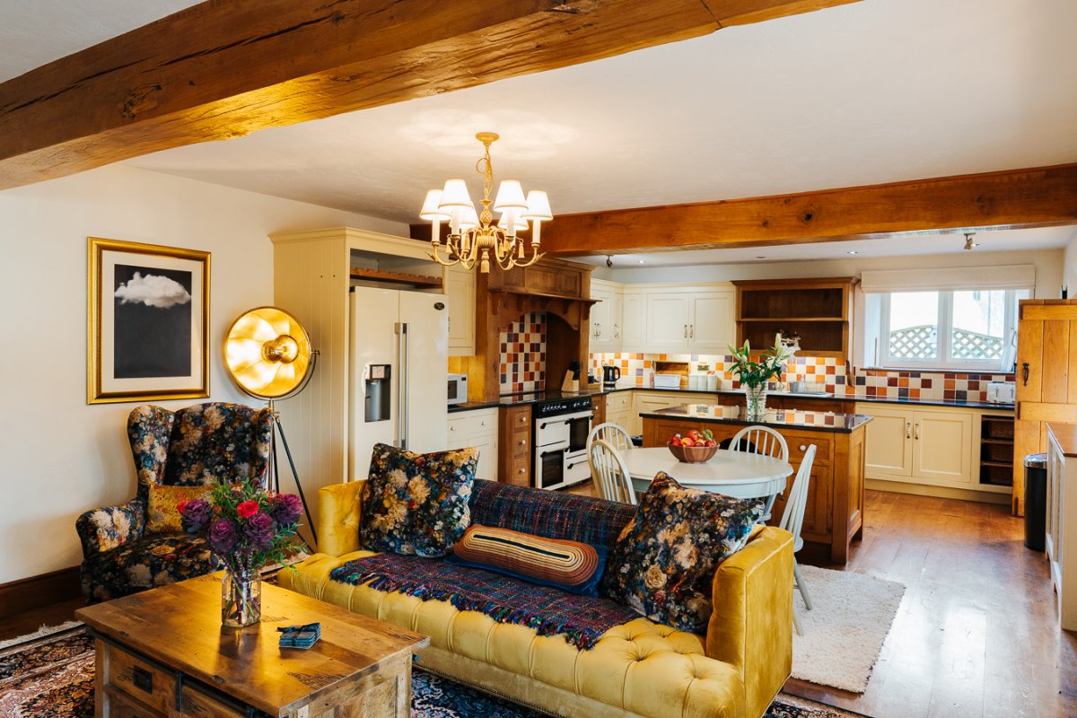 Comfy seating area in kitchen at Millstone Barn