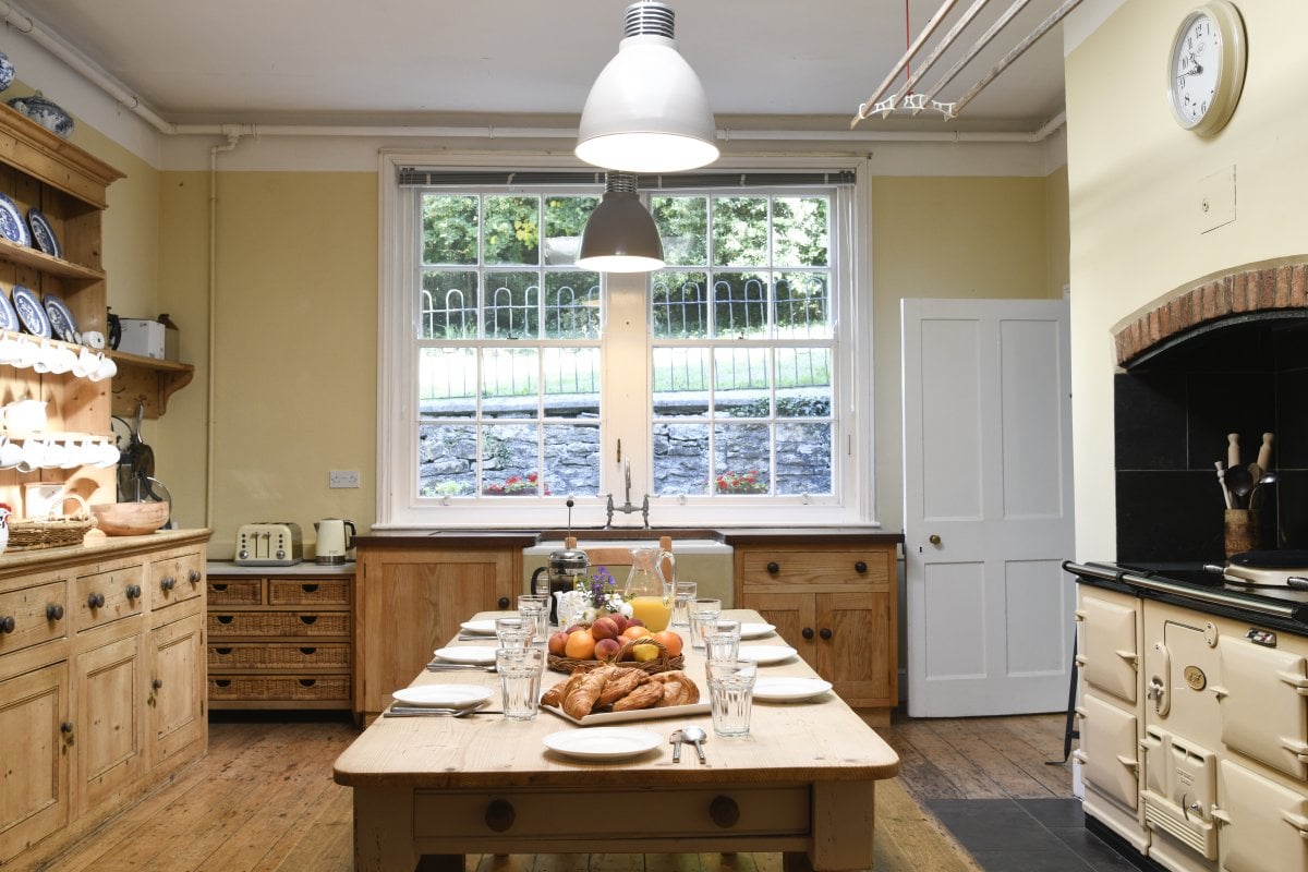 Huge farmhouse kitchen with original dresser and AGA