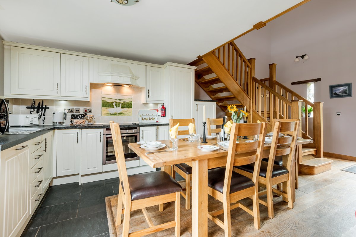Kidwelly Farm Cottages - dining table in Y Felin