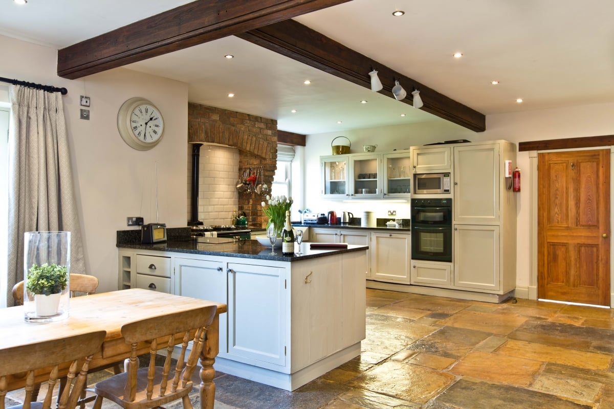 Spacious, fully-equipped, farmhouse kitchen with informal dining area and open plan layout including main lounge