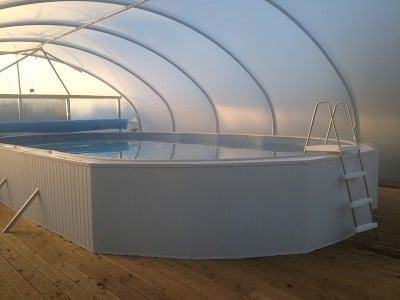 Heated pool with enclosure