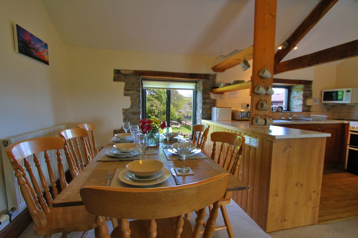 Dining area looking out to lawn in Woodland View