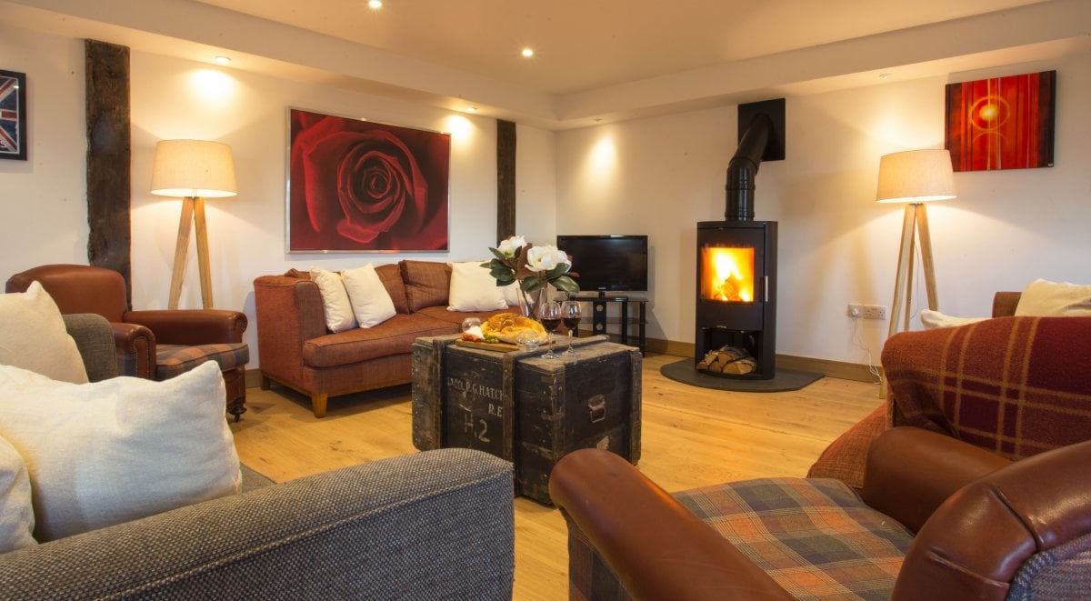 Drum Barn lounge with cosy wood burner
