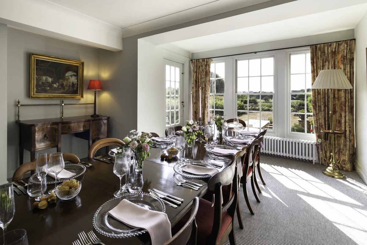 The Dining room seats up to 24 guests, with views to the terrace