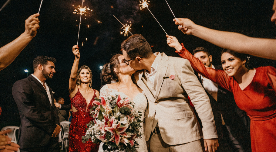 Couple celebrating a wedding with sparklers