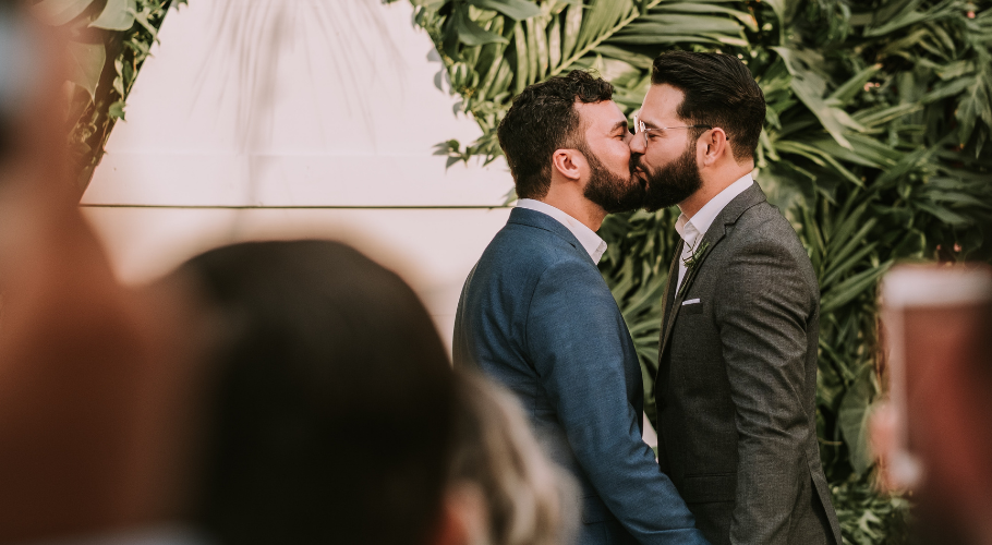 Couple kissing on wedding day