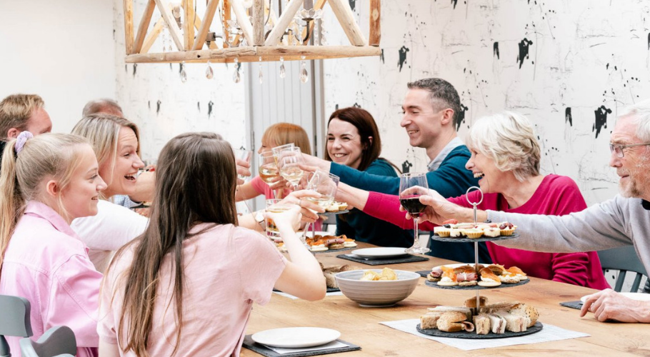 People laughing around table on holiday