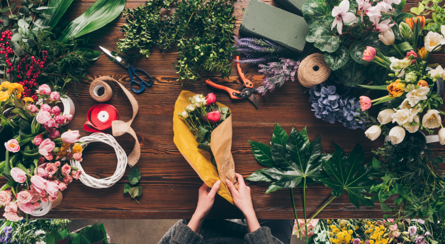 Woman preparing bouquet of flowers