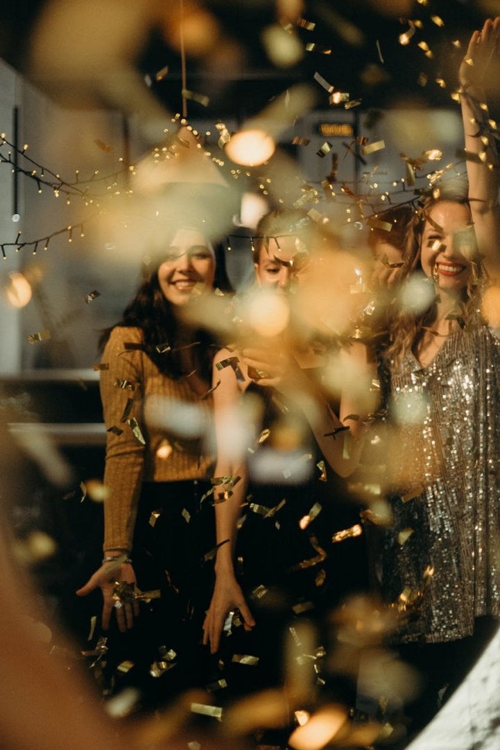 Women partying with confetti